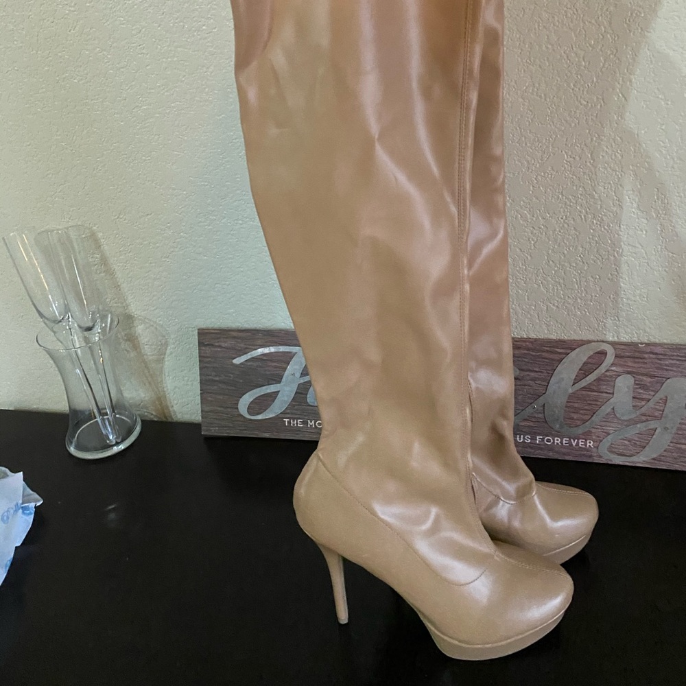 Thigh high tan stiletto boots